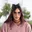 Person with sunglasses and cat ears headband