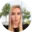 A blonde woman with long hair and striking makeup