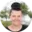 Smiling woman with a bun hairstyle outdoors