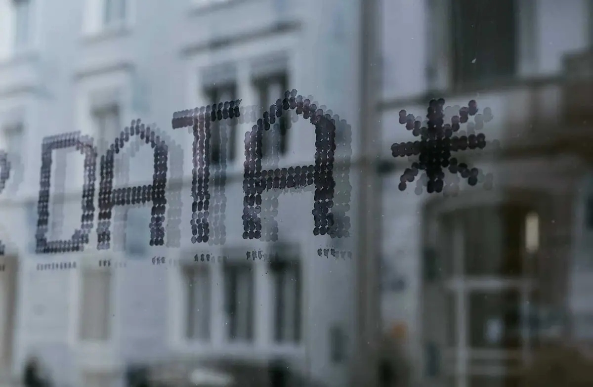 Close-up of DATA text art on a glass surface